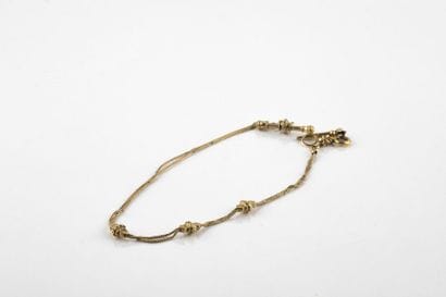 Yellow gold watch chain with three flows,...