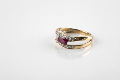 Yellow and white gold ring adorned with a...