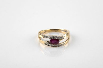 Yellow and white gold ring adorned with a...