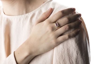 Yellow and white gold ring adorned with a...