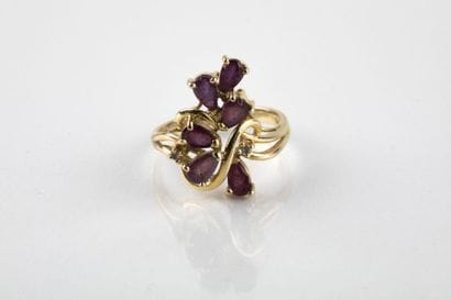 Yellow gold ring decorated with pear-shaped...