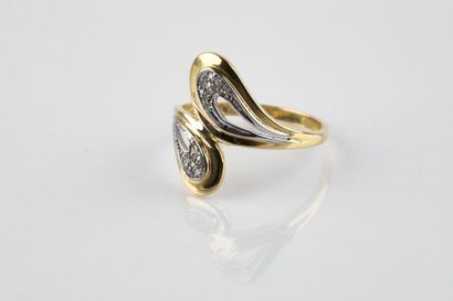 Moving ring in yellow and white gold holding...
