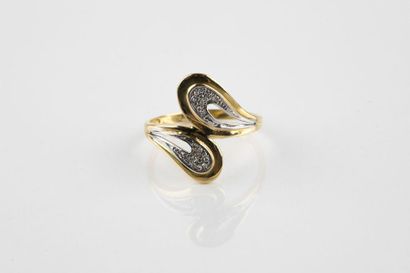 Moving ring in yellow and white gold holding...