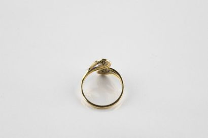Moving ring in yellow and white gold holding...