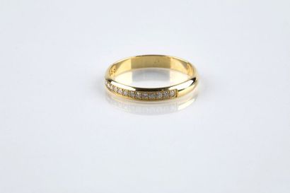 A yellow gold half wedding ring set with...