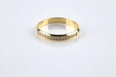 A yellow gold half wedding ring set with...
