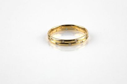Double yellow gold ring set with twenty diamonds...