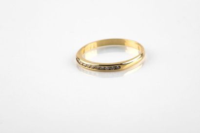 A yellow gold half wedding ring set with...