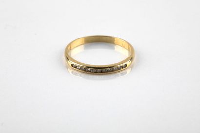 A yellow gold half wedding ring set with...