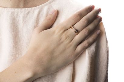 Brushed pink gold wedding ring enhanced with...