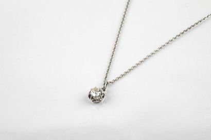 Round white gold chain with a pendant adorned...