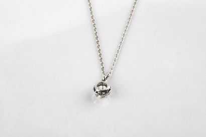 Round white gold chain with a pendant adorned...