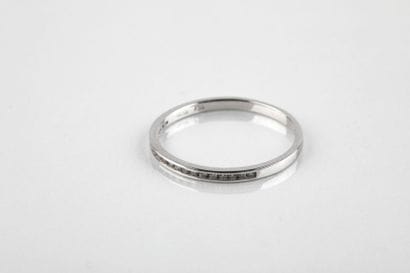 Half wedding ring in white gold set with...