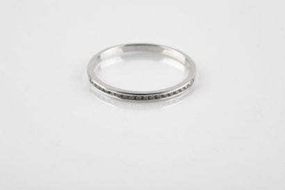 Half wedding ring in white gold set with...