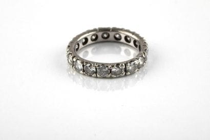 American white gold wedding ring, set with...