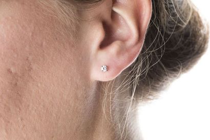 Pair of white gold ear studs, decorated with...