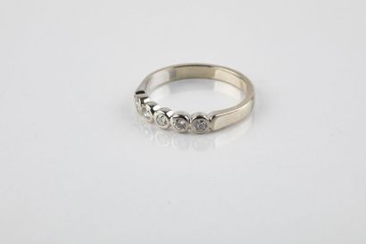 Half wedding ring in white gold set with...