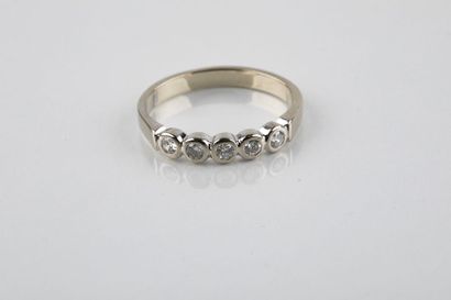Half wedding ring in white gold set with...