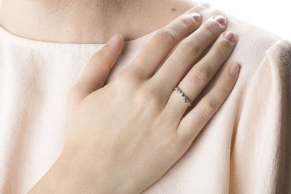 Half wedding ring in white gold set with...