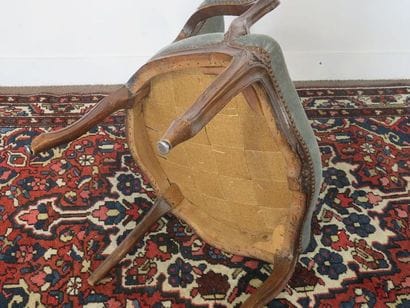 Moulded beech armchair carved with flowers,...