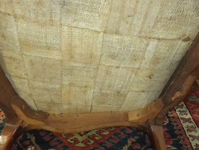 Armchair with flat back in moulded and carved...