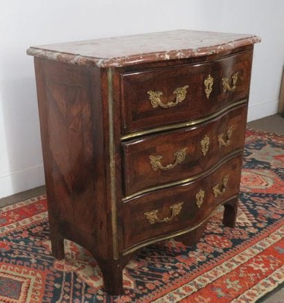 Small chest of drawers made of curly veneer...