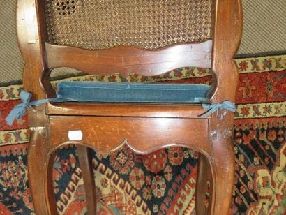 Pair of moulded beech chairs, cane seat and...