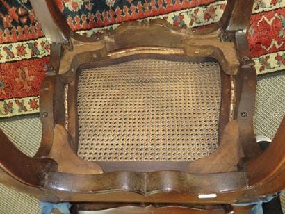 Pair of moulded beech chairs, cane seat and...
