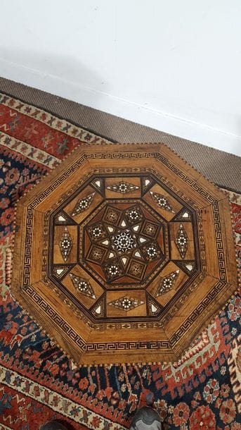 Octagonal pedestal table with rich marquetry...