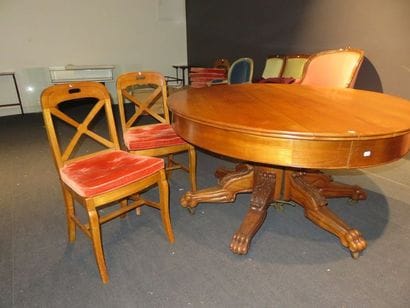 Cherry wood pedestal table with an oval top...