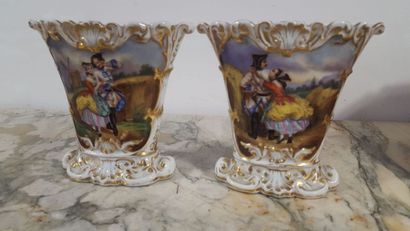 Pair of polychrome porcelain bridal vases...