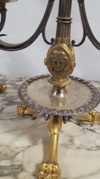 Paire de bougeoirs en bronze doré et argenté...