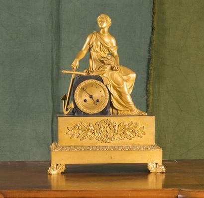 Pendule en bronze ciselé, doré et patiné....