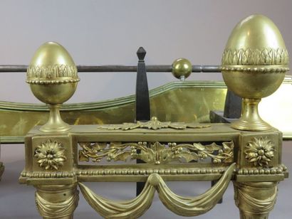Pair of ormolu bronze andirons, the tapered...