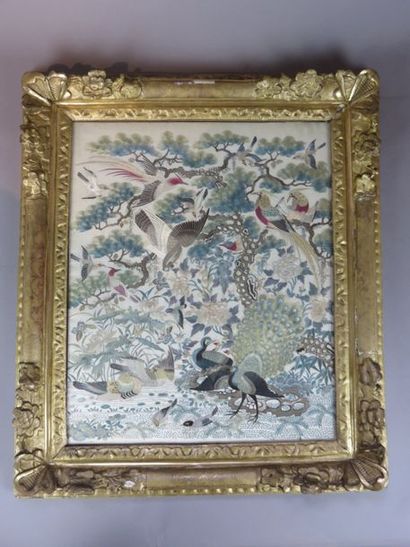 Embroidery on silk depicting numerous birds...