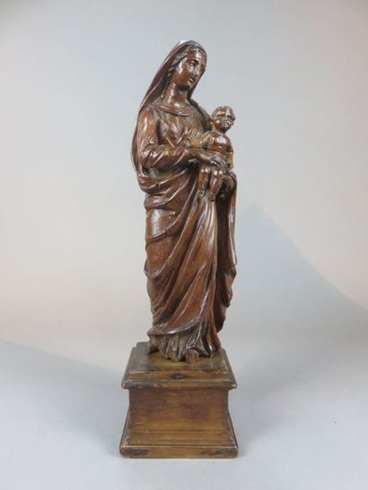 Virgin and Child in pine wood carved on a...