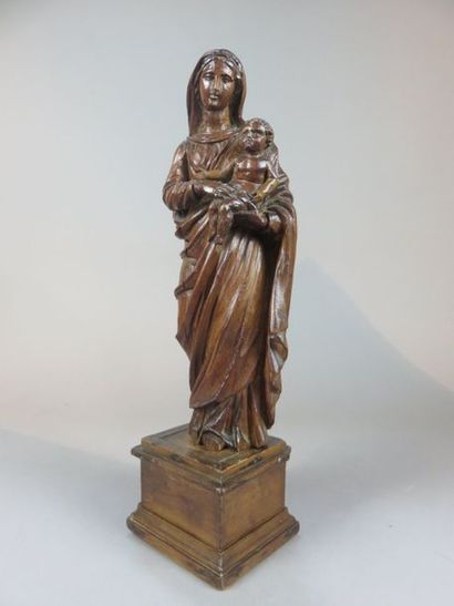 Virgin and Child in pine wood carved on a...