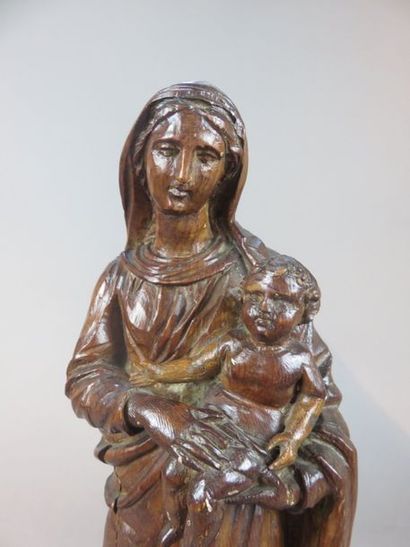 Virgin and Child in pine wood carved on a...