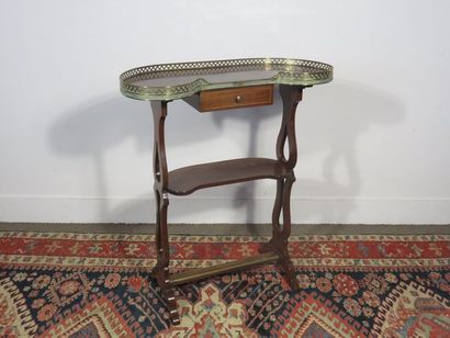 Mahogany kidney table opening to a small...