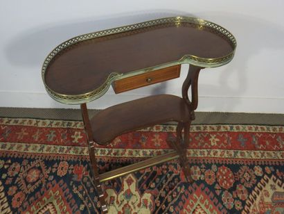 Mahogany kidney table opening to a small...