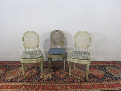 Suite of three cream lacquered wooden chairs,...