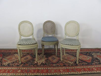 Suite of three cream lacquered wooden chairs,...