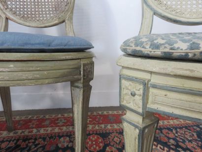 Suite of three cream lacquered wooden chairs,...