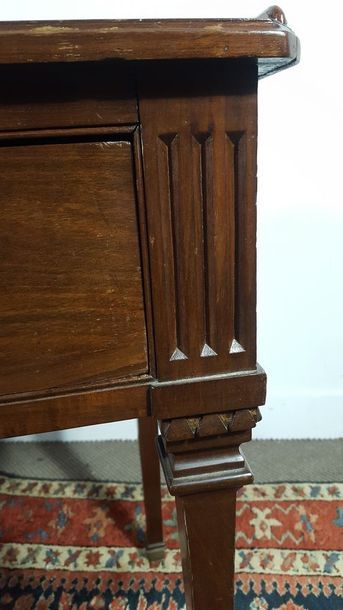 Small mahogany desk opening with three drawers...