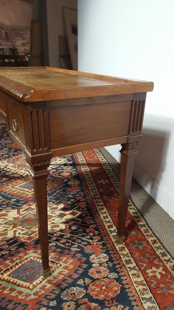 Small mahogany desk opening with three drawers...