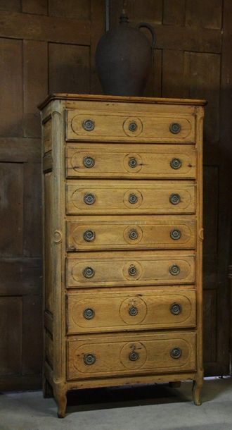 Oak tree trunk. Opens with seven molded drawers....