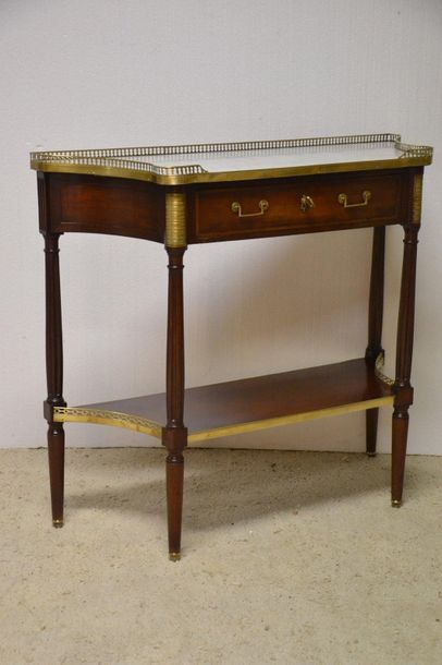 Mahogany and mahogany veneer console. The...