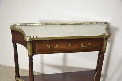 Mahogany and mahogany veneer console. The...