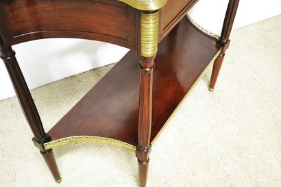 Mahogany and mahogany veneer console. The...