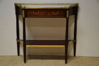 Mahogany and mahogany veneer console. The...